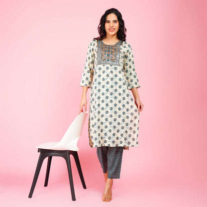 Elegant White Printed Kurta Set with Embroidered Yoke and Contrasting Blue Straight Pants for Women