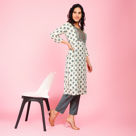 Elegant White Printed Kurta Set with Embroidered Yoke and Contrasting Blue Straight Pants for Women